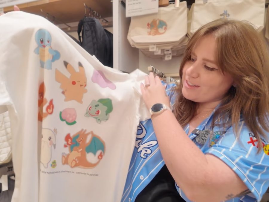 Bry admiring a Pokémon Pokopia T-shirt while shopping